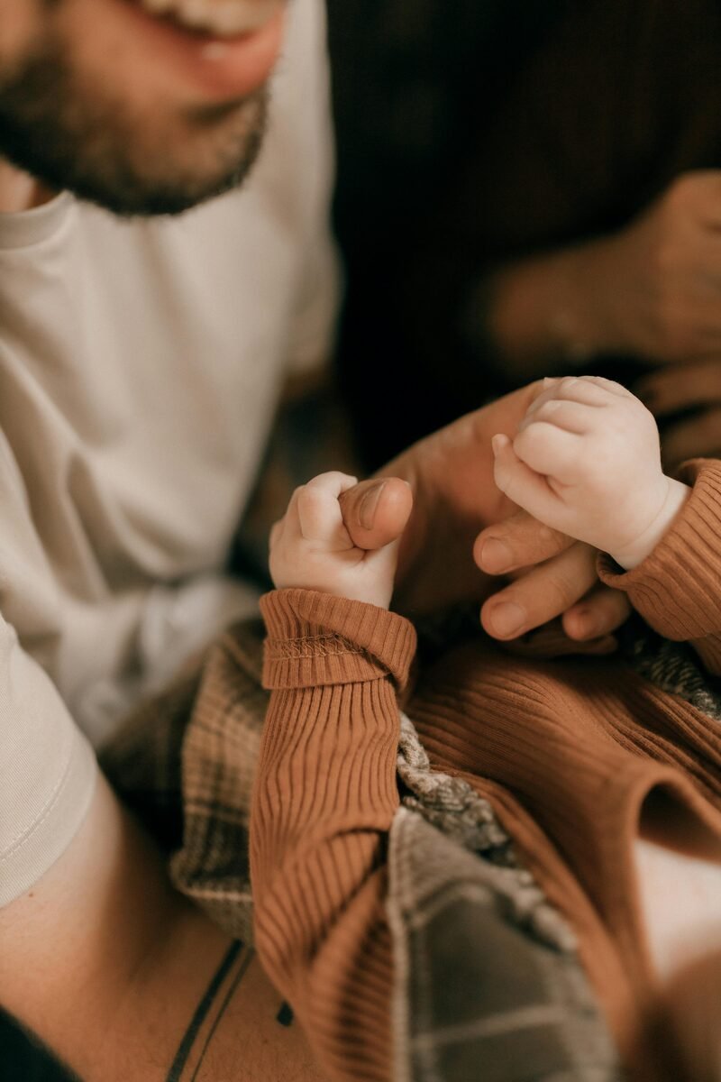 Parent holding baby in a calm reflective moment