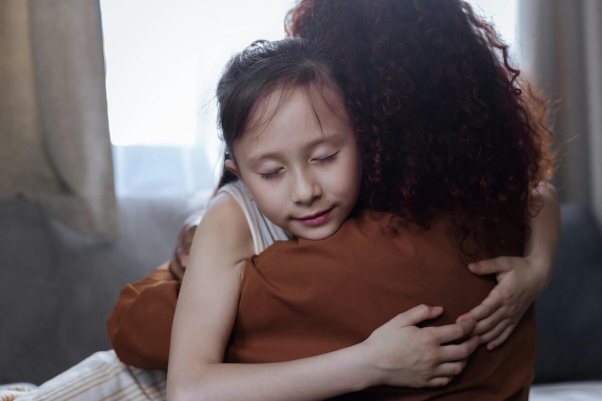 Parent listening closely to child