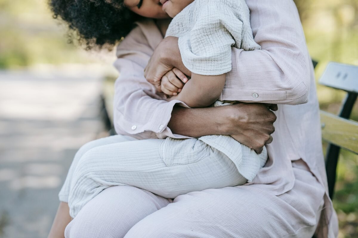 Parent comforting child after a difficult moment